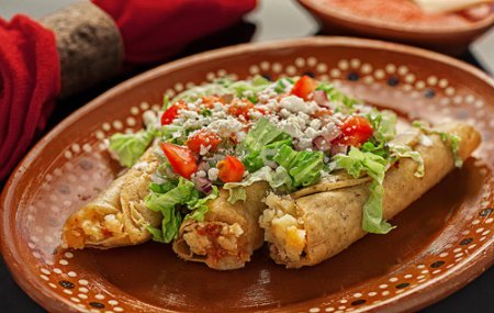 Fried Chorizo and Potato Tacos covered with many fresh ingredients