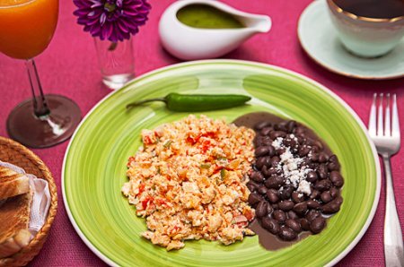 Mexican Style Eggs accompanied with pot beans