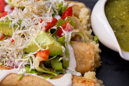 Fried Potato Tacos covered with many ingredients